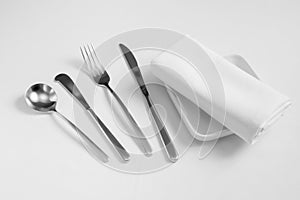 Fork,sponn,knife ,dish and tablecloth