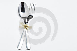 Fork and spoon with ribbon