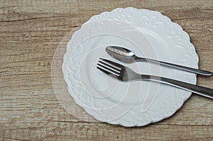 Fork, Spoon and Table Knife on the white background photo