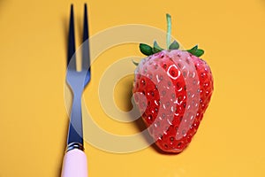 Fork and strawberries