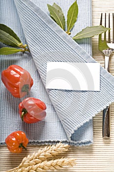 Fork and vegetabels on blue napkin