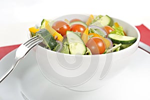 Fork with vegetables healthy salad bowl