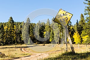 Forked dirt road dead end sign