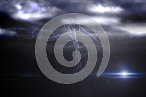 Forked lightning against cloudy sky