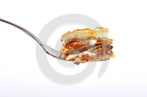 Forkful of lasagna bolognese