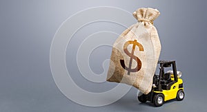 Forklift carrying a dollar money bag. Anti-crisis budget. Strongest financial assistance, business support. Borrowing on capital