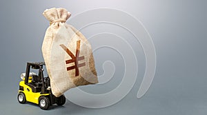 A forklift carrying a huge Yen Yuan money bag. Anti-crisis budget. Borrowing on capital market. Strongest financial assistance
