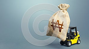 Forklift carrying a south korean won money bag. Strongest financial assistance, business support. Stimulating economy. Borrowing