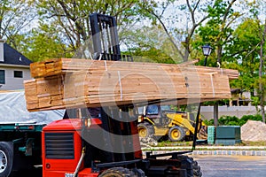 Forklift on a construction preparing to construction building material parts