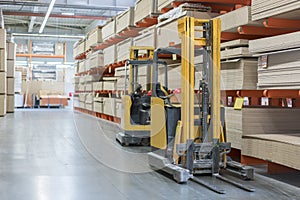 forklift in a construction shop. Construction Materials. Stacking truck in wholesale warehouse