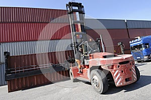 Forklift, container and truck photo
