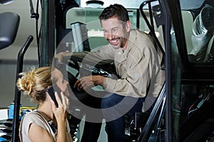 forklift driver and female supervisor on phone