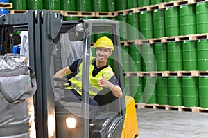 Forklift driver in a logistics hall of a chemical warehouse