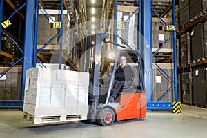 Forklift in front of storage racks