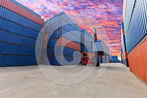 Forklift handling the container box at dockyard with beautiful s