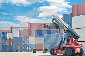 Forklift handling container box loading to truck in import expor