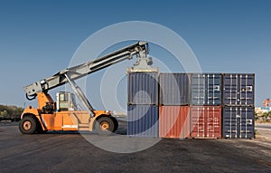 Forklift handling the containers box