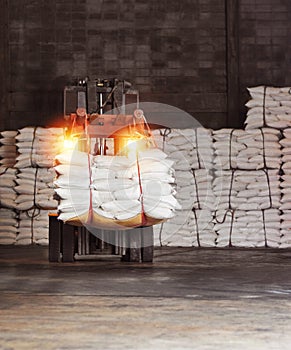 Forklift handling sugar bag for stuffing into container for export