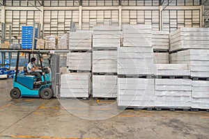 Forklift in the large modern warehouse