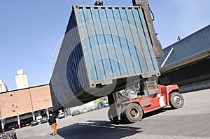 Forklift lifting container photo