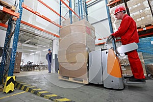 Forklift loader with cardboard freight moving in s