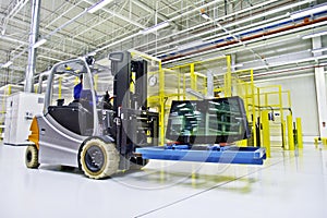Forklift loader in large modern warehouse