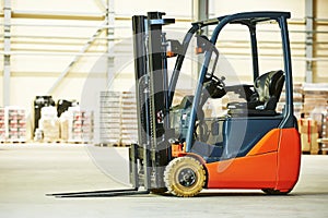 Forklift loader stacker truck at warehouse