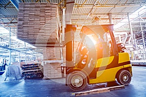 Forklift loader in storage warehouse ship yard. Distribution products.