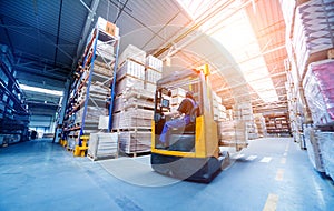 Forklift loader in storage warehouse ship yard. Distribution products.