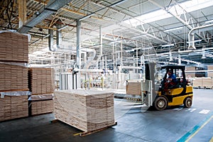 Forklift loader in storage warehouse ship yard. Distribution products.