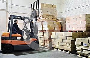 Forklift loader in warehouse