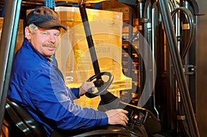 Forklift loader worker at warehouse