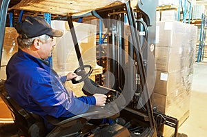 Forklift loader worker at warehouse