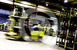 Forklift moving in factory