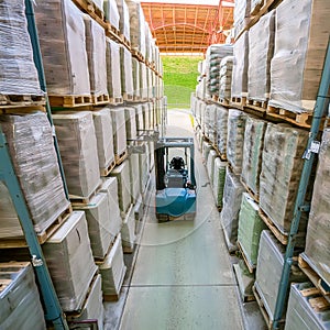 Forklift Moving Through Warehouse Filled With Boxes. Generative AI