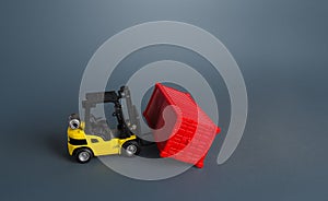 Forklift and red container. Effective organization of goods storage in a warehouse. Warehousing concept and logistics