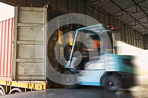 Forklift Tractor Loading Cargo Boxes Pallets into Container Trucks. Shipping Truck. Supply Chain Cargo Shipment. Distribution