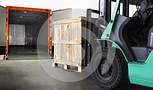 Forklift Tractor Loading Wooden Crate Boxes into Cargo Container. Shipping Trucks. Delivery Cargo Service. Supply Chain Goods