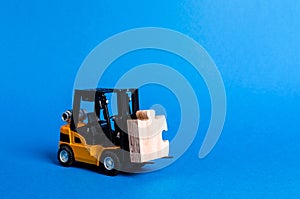 Forklift truck carries part of the puzzle. Business processes and globalization concept. Take a Niche Market. Take part in a large