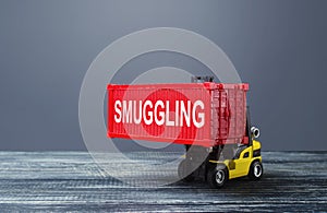 A forklift truck carries a red container labeled smuggling. Transportation of illegal prohibited goods. Border control, high photo