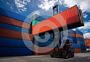 Forklift truck handling container box in shipping industry