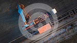 Forklift truck lifting cargo container in shipping yard for transportation import export and logistic industrial, Aerial view