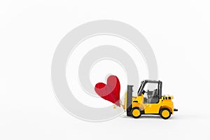 Forklift truck with red heart isolate on white background
