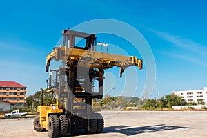 Forklift truck in shipping yard.