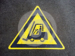 Forklift truck sign on the asphalt