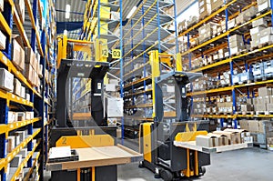 Forklift truck in a warehouse of a commercial enterprise, high r