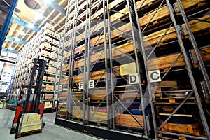 Forklift trucks in a high-bay warehouse - storage of goods in an industrial company