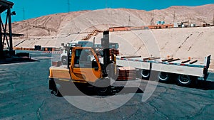 Forklift-type machinery in the process of loading copper mining plates for sale and export photo
