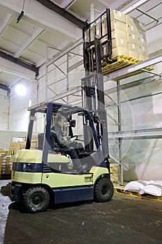 Forklift in warehouse