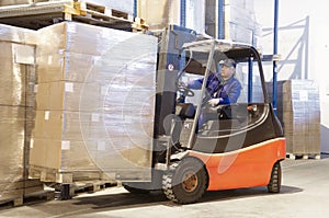 Forklift at work with driver